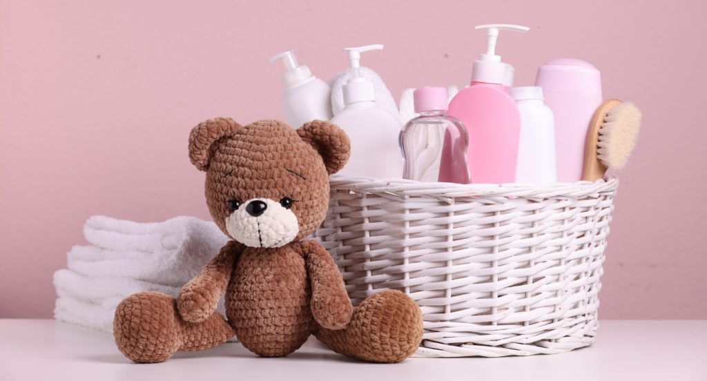 A teddy toy placed near to basket