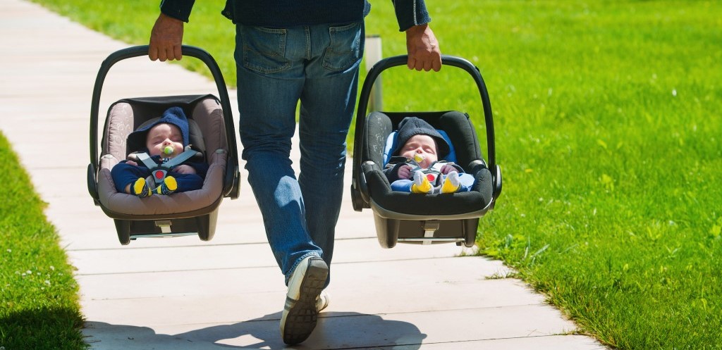 Twin babies in carriers