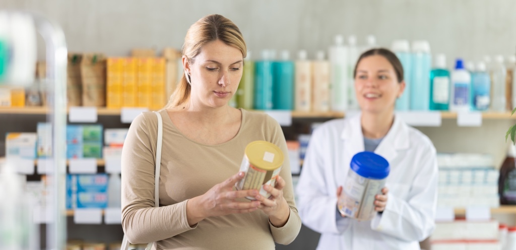 Mom checking baby formula