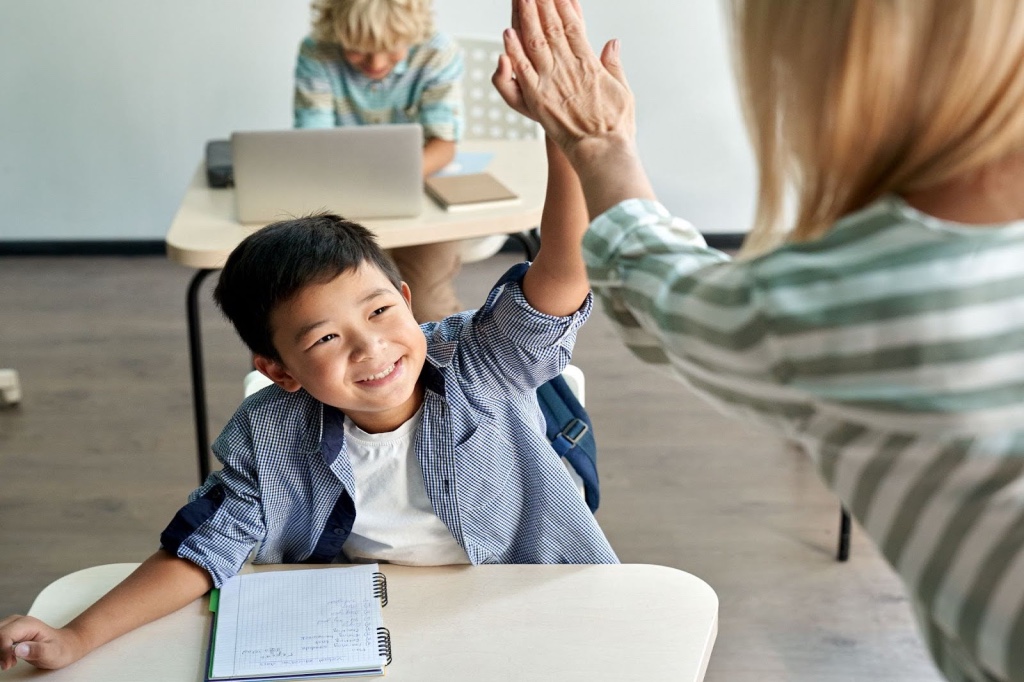 Teacher appreciating baby boy